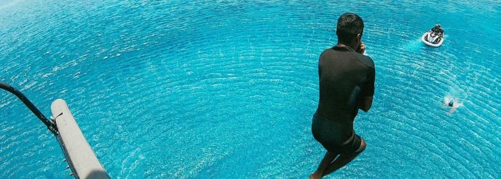 Safe helicopter jump into ocean