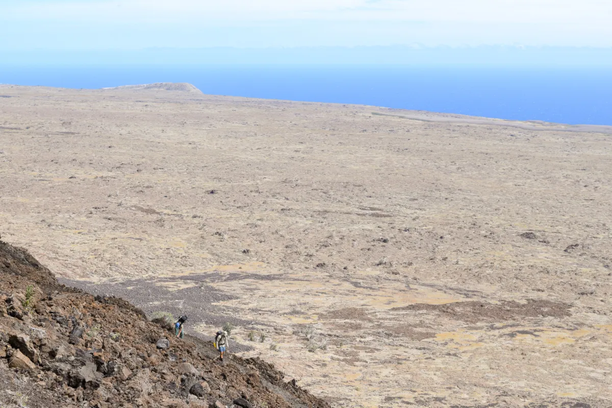 hikers descend hilina pali switchbacks
