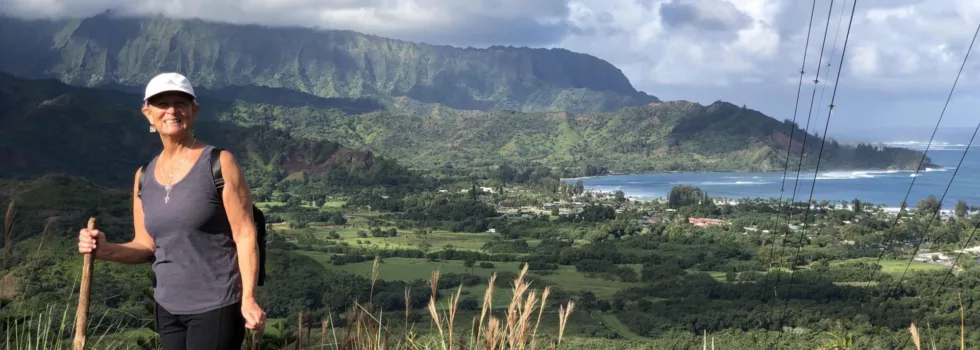 Senior woman hiking above hanalei bay kauai