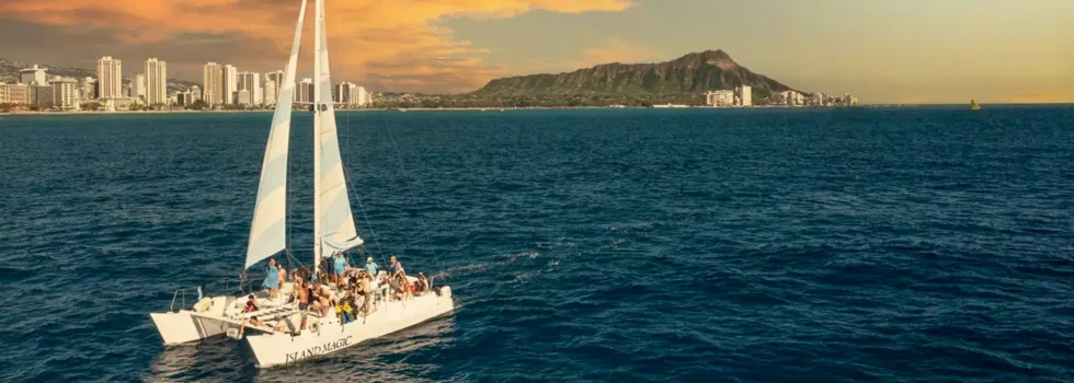 Small catamaran sunset sail