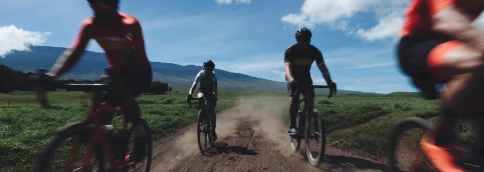 Bike ride on gravel road pasture land hawaii