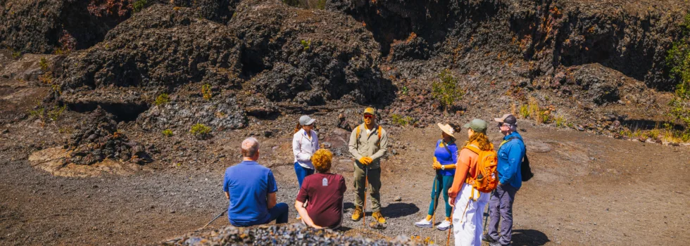 Volcano tour guide explaining eruption