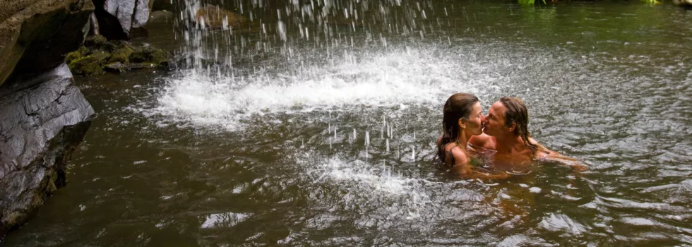 Swimming in waterfall near kona