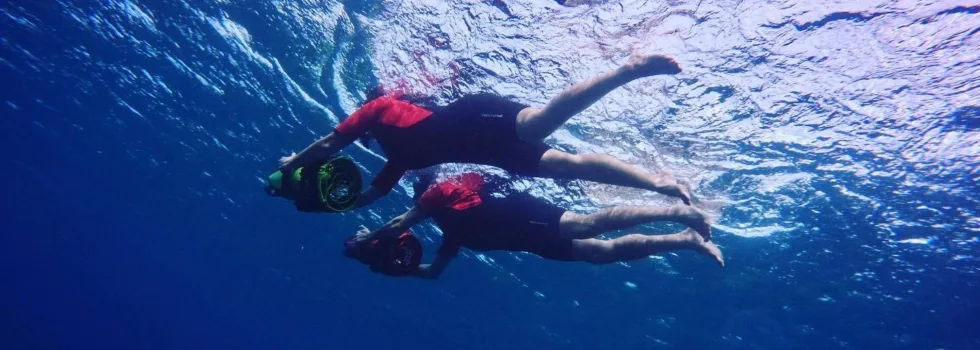Two people sea scooter snorkeling maui