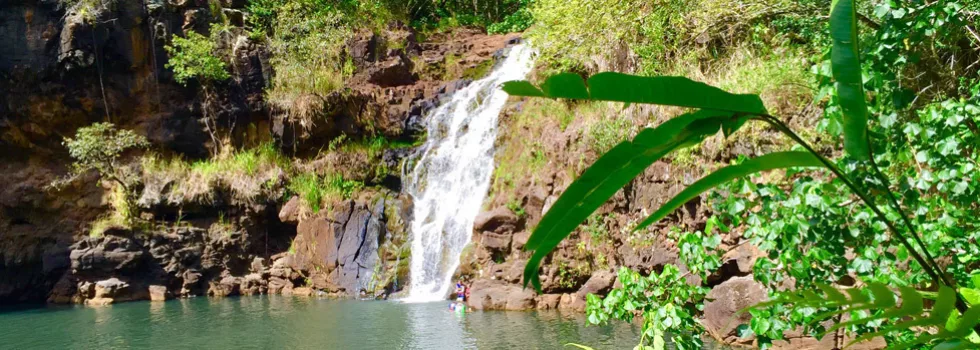 Swim under waterfall in hawaii