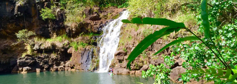 Swim under waterfall in hawaii