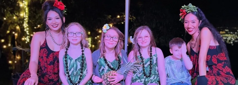 Child portrait with luau staff