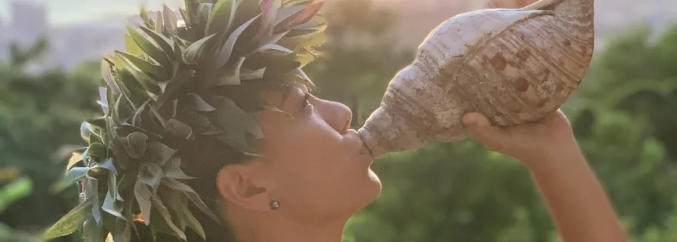 Conch shell blowing during oahu luau