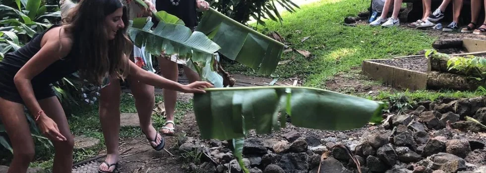 Fanning the imu pit oahu luau