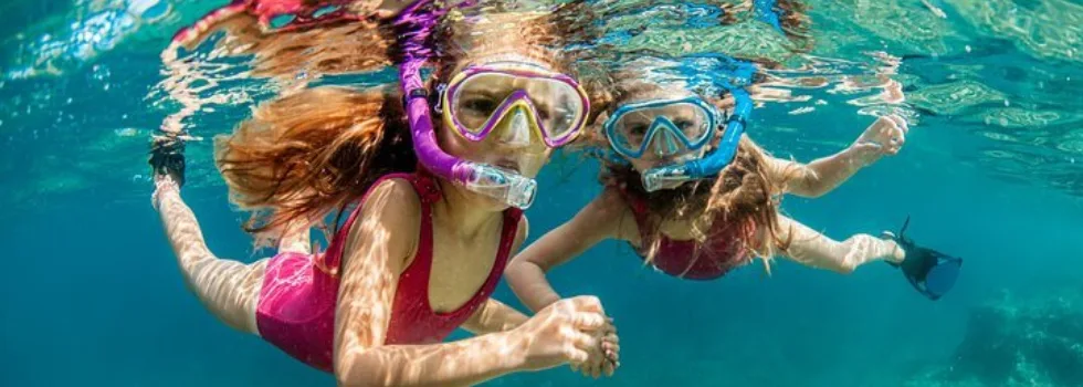 Kids snorkel in waikiki