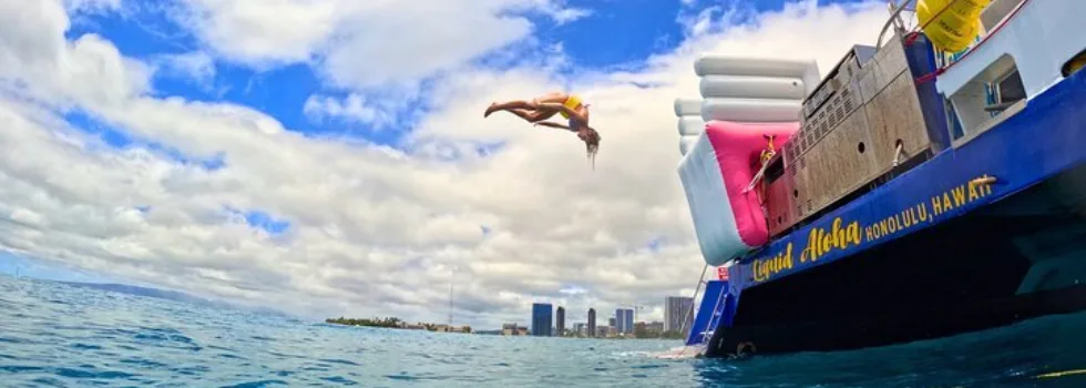 Woman backflips off waikiki catamaran