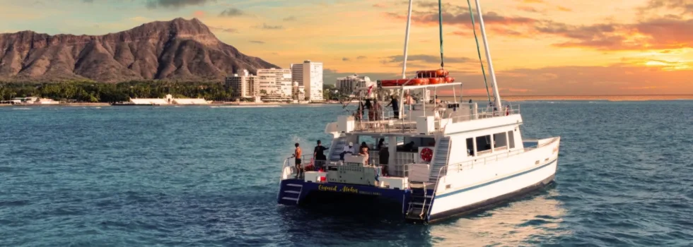 Sunset over diamond head catamaran
