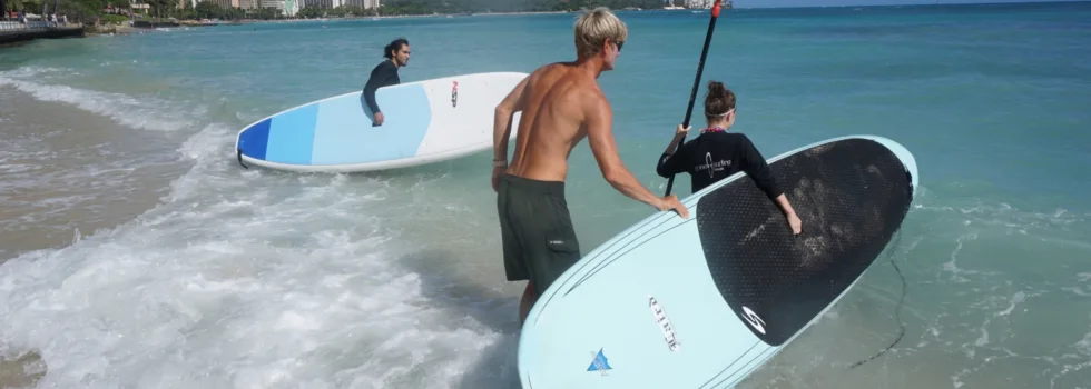 Launching a sup in waikiki