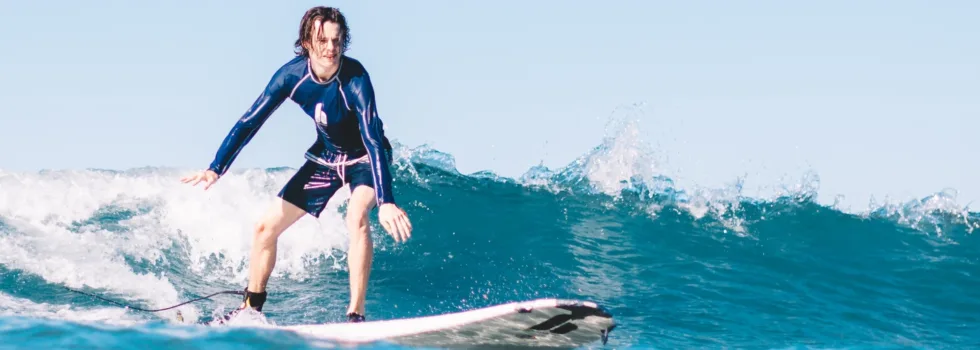 Man learns to ride waves in waikiki