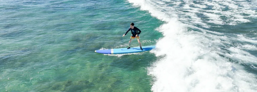 Surfer riding waves at publics beach waikiki
