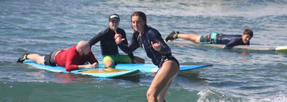 Young surfer girl smiling
