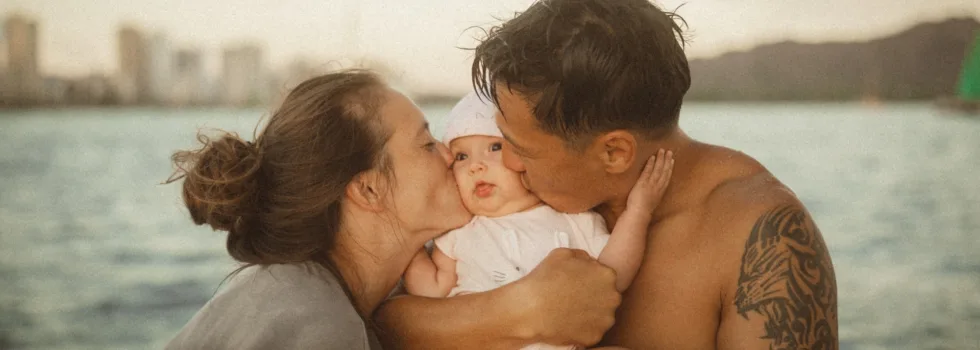 Couple kissing baby small boat charter waikiki