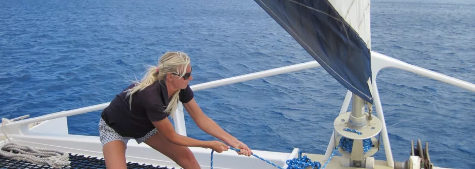 Raising the jib hawaii catamaran
