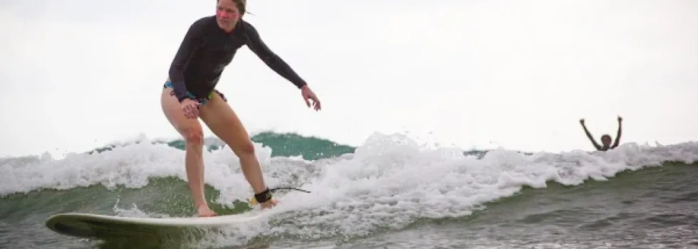 Woman learning to surf hawaii