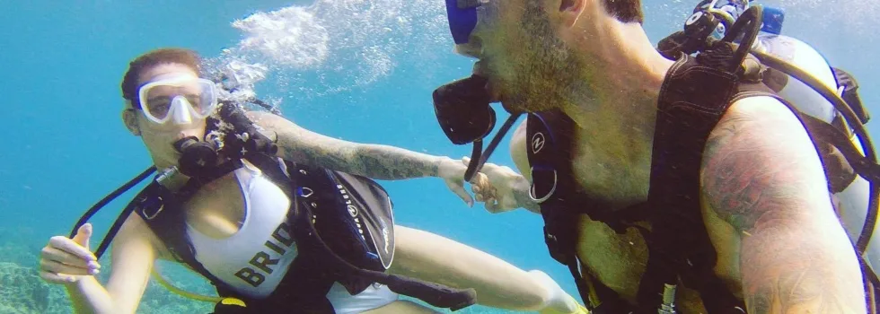 Young couple scuba maui honeymoon