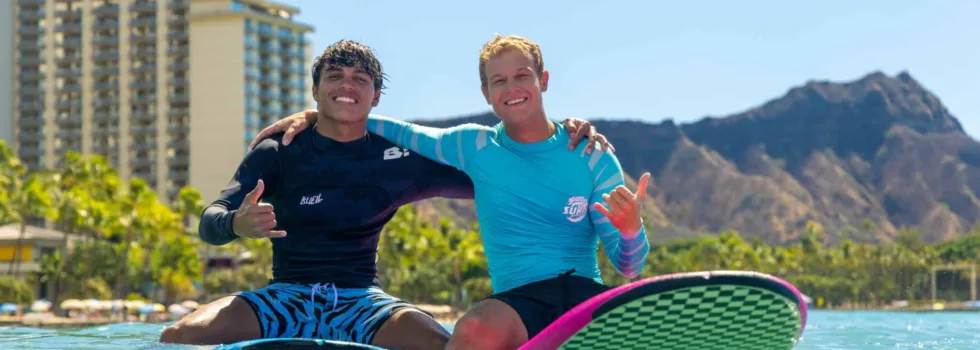 Bros hug in the waikiki surf