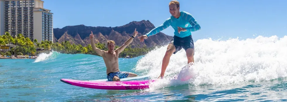 Guy learns to surf while instructor cheers png