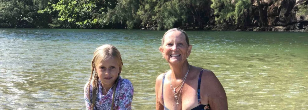 Senior woman with child lumahai beach kauai