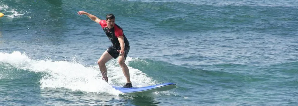 Man taking surf lesson in poipu