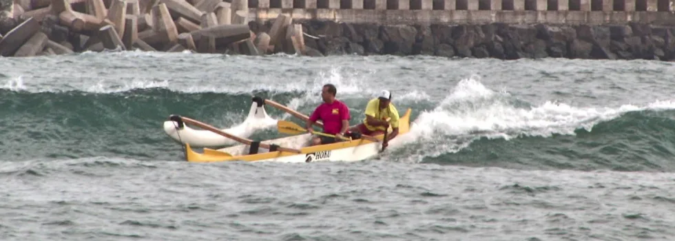 Canoe surfing in poipu