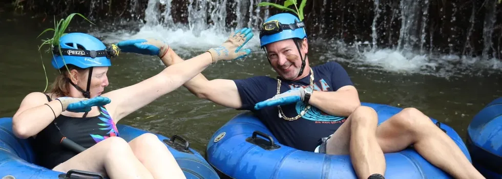 Hawaii tubing past waterfall