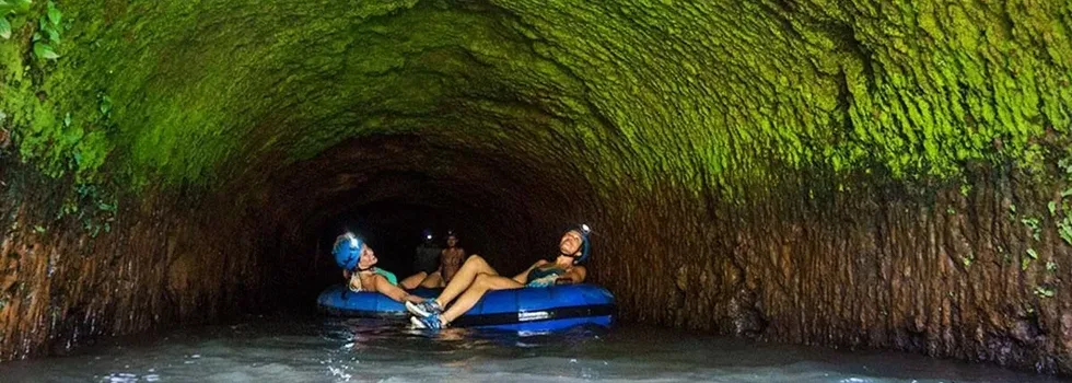 Tubing through cave tunnels kauai