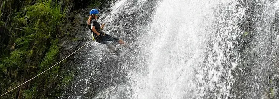 Female rappells down kauai waterfall