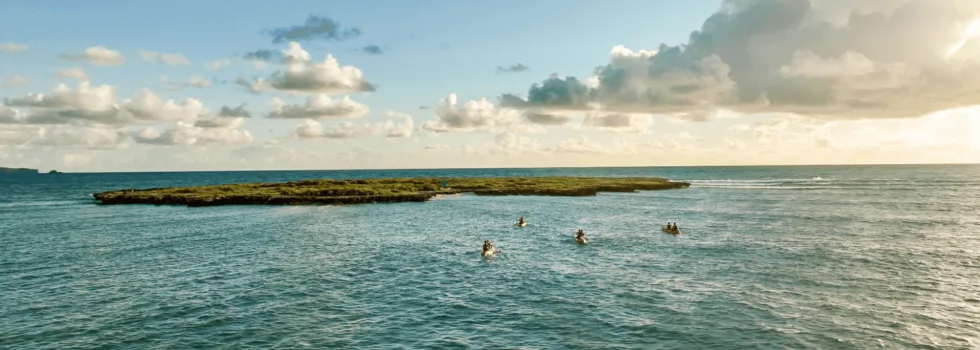 Kayaks approaching flat island kailua