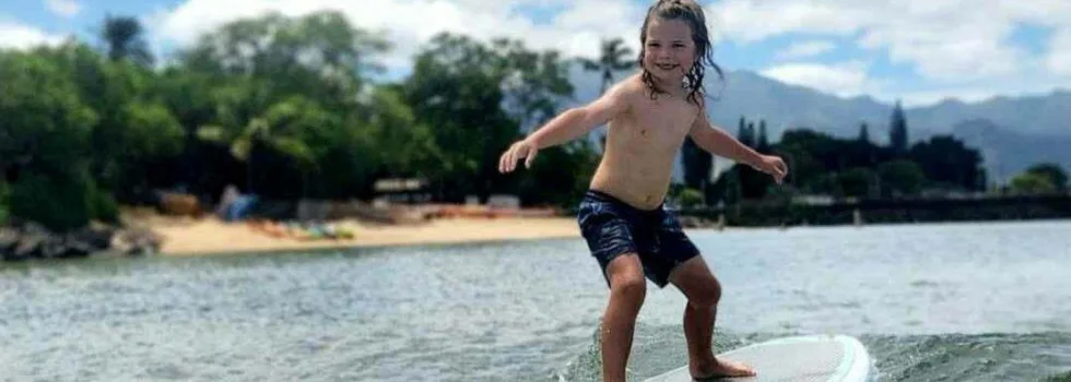 Kid surfing at pueana point