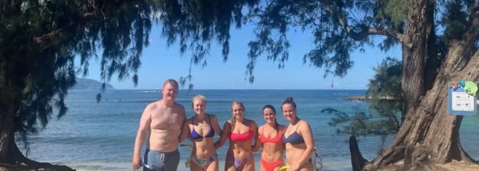 Happy family on north shore beach bus tour