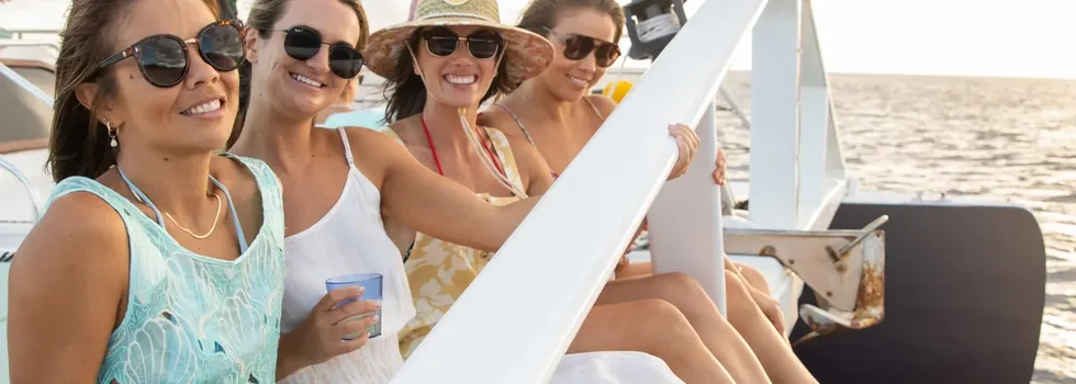 Ladies relaxing on the bow koolina catamaran