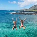 Girls jumping into water kokohead background thumb