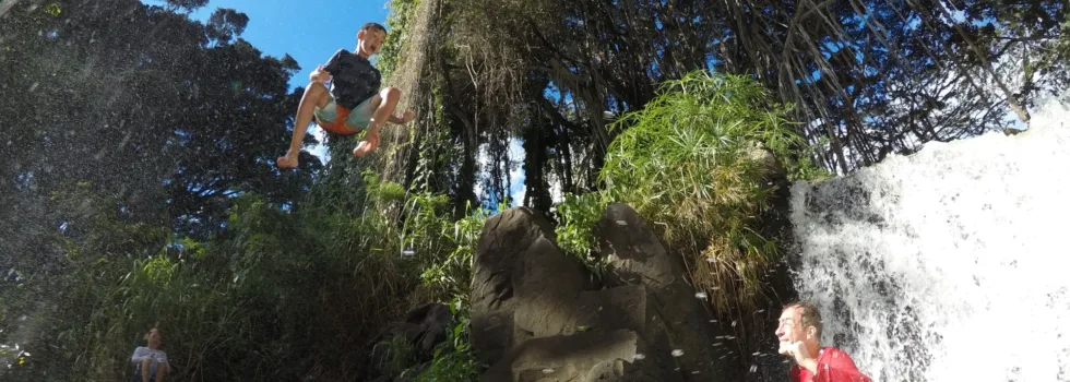 Kid jumping off waterfall oahu tour