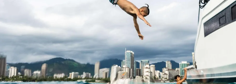 Kid backflips off waikiki boat