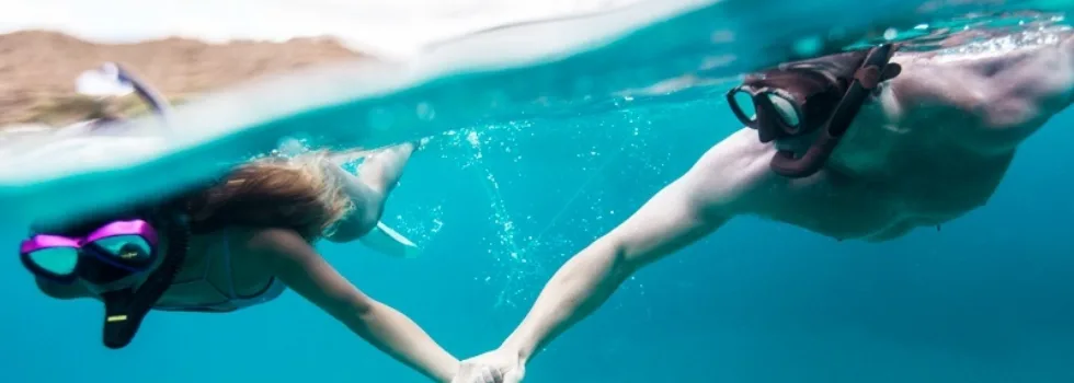 Snorkeling guests off luxury catamaran