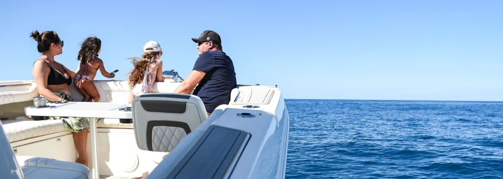Family sits on bow of luxury waikiki boat