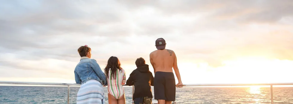 Family watches sunset off luxury waikiki boat