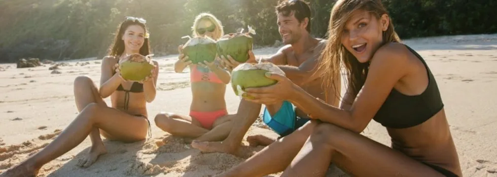 Hookipa friends drinking coconuts on beach