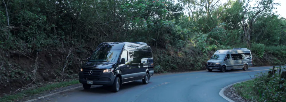 Tour bus driving road to hana