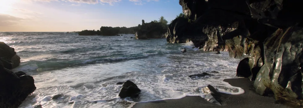 Black sand beach with volcanic rocks