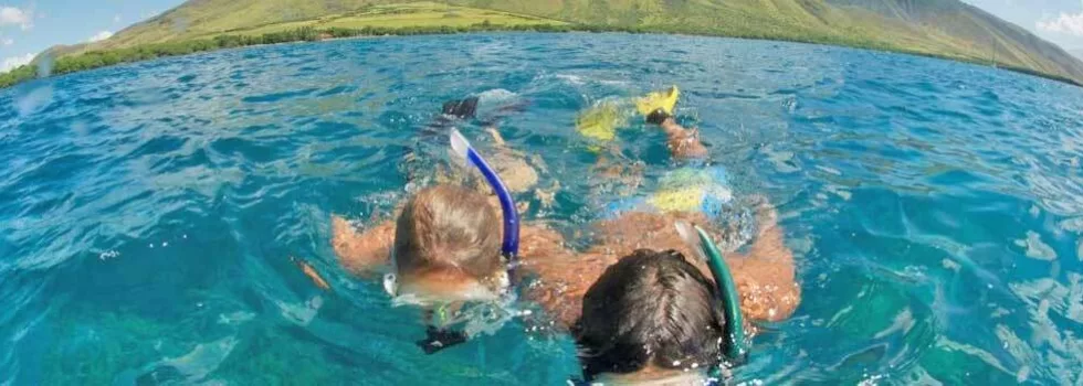 Snorkeling from hawaiian canoe