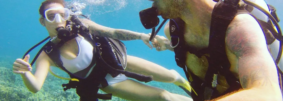Young couple scuba maui honeymoon