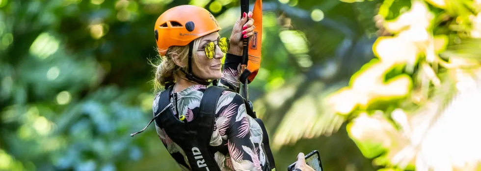 Haiku zipline customer flys over jungle