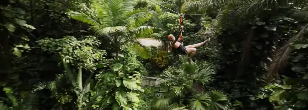 Woman ziplining in maui