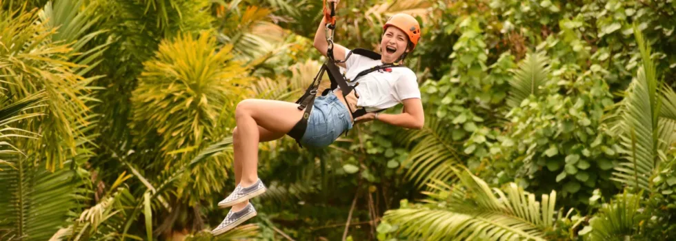 Zipline girl smiling big while flying